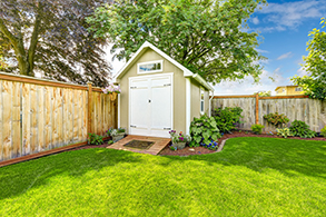 A shed in a very well-curated backyard