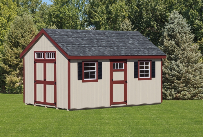 A classic, A-Frame shed on the grass with trees in the background.